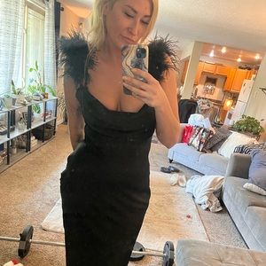 Black satin evening dress with feather details on sleeves. Worn once.